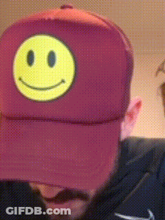 Man In Purple Hat With Smiley Face GIF