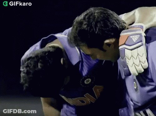 Man In Purple India Shirt Hugging GIF