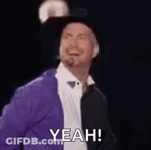 Man In Purple Jacket And Black Hat Smiling Says Yeah GIF