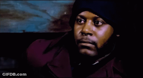 Man In Purple Jacket And Blue Hat Close Up GIF