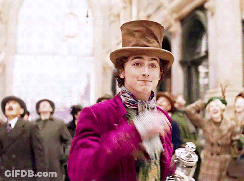 Man In Purple Jacket And Top Hat Holding Jar GIF