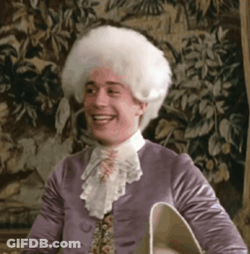 Man In Purple Jacket And White Wig Smiling GIF