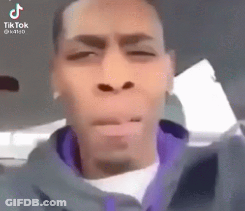 Man In Purple Jacket Funny Face In Car GIF