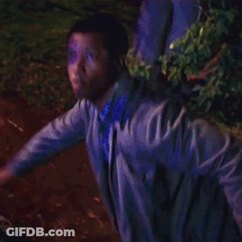 Man In Purple Jacket Holding Torch GIF