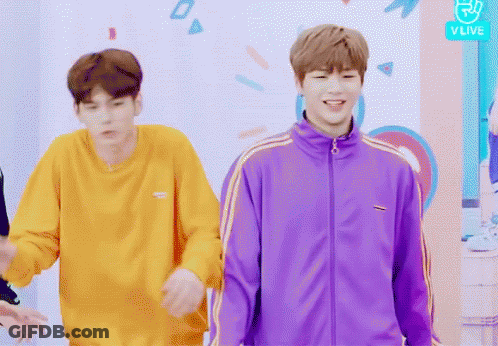 Man In Purple Jacket Next To Man In Yellow Sweatshirt GIF