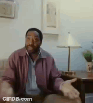 Man In Purple Jacket Sitting On Couch GIF
