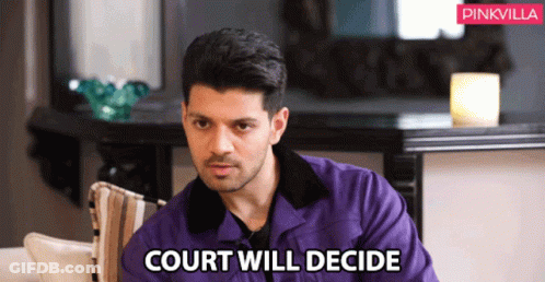 Man In Purple Jacket Sitting On Couch Court Will Decide GIF