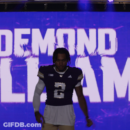 Man In Purple Jersey Number 2 In Front Of Demond Liam Screen GIF