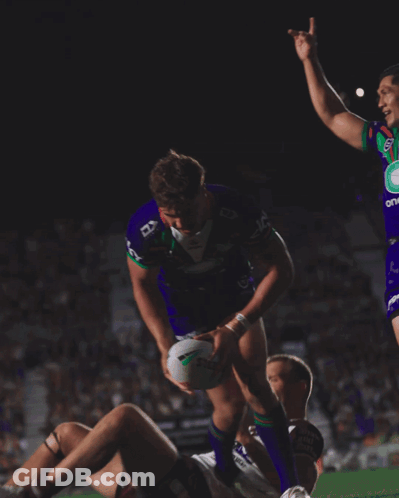 Man In Purple Jersey Number 7 Hugging Another Man GIF