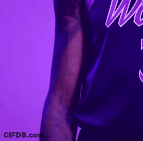 Man In Purple Jersey Saying Wolves GIF