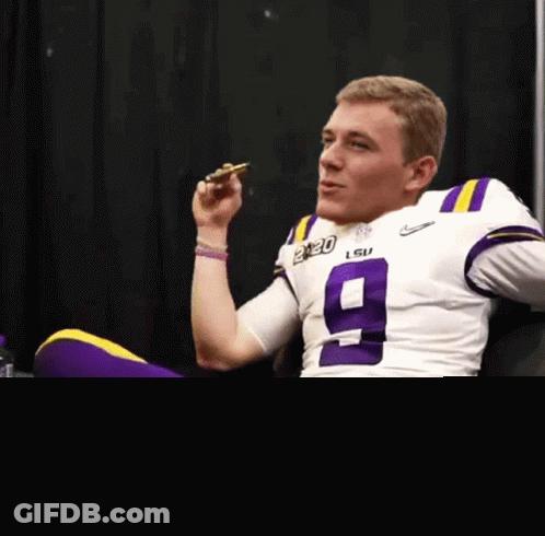Man In Purple LSU Jersey Eating Pizza GIF