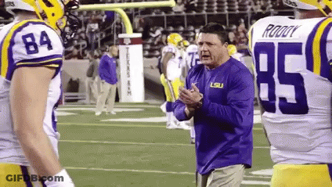 Man In Purple LSU Shirt On Football Field GIF