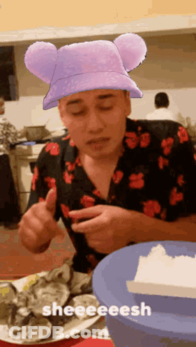 Man In Purple Mickey Ears Hat Eating Oysters GIF