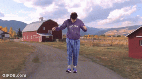 Man In Purple Moon Sweatshirt Dancing GIF