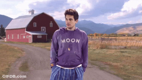 Man In Purple Moon Sweatshirt In Front Of Red Barn GIF