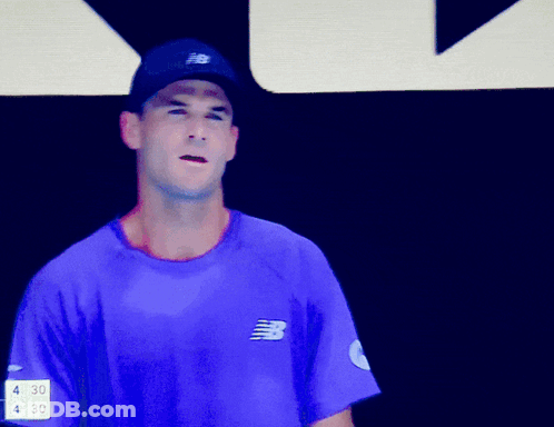 Man In Purple New Balance Logo Shirt GIF