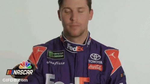 Man In Purple Orange Racing Suit Funny Face GIF