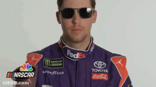 Man In Purple Race Suit And Sunglasses With NASCAR Logo GIF