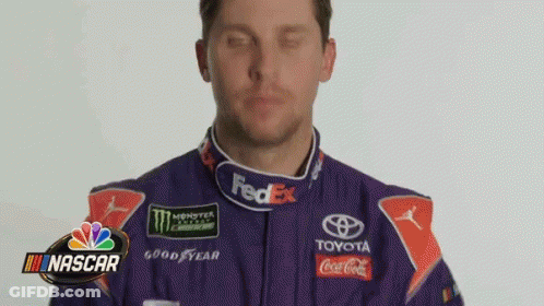 Man In Purple Racing Suit With Logos GIF