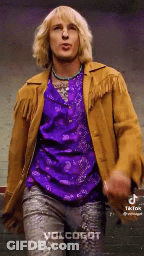 Man In Purple Shirt And Brown Jacket Dancing GIF