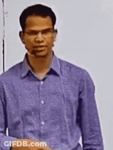Man In Purple Shirt And Glasses Standing In Front Of Whiteboard GIF