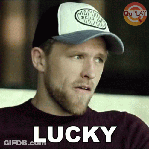 Man In Purple Shirt And Hat Saying Lucky GIF