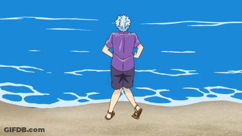 Man In Purple Shirt And Shorts Running On Beach GIF