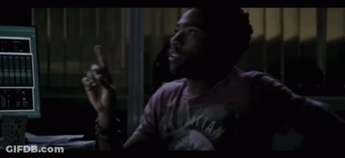 Man In Purple Shirt At Computer GIF