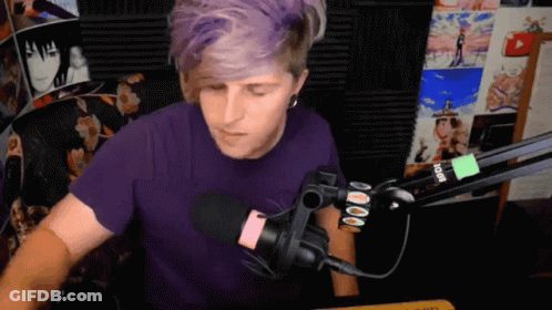 Man In Purple Shirt At Rode Microphone GIF