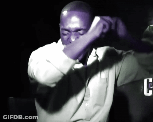 Man In Purple Shirt Covering Face GIF