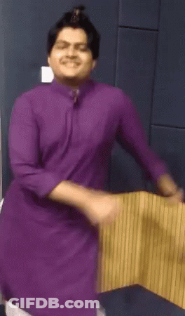 Man In Purple Shirt Dancing And Smiling GIF