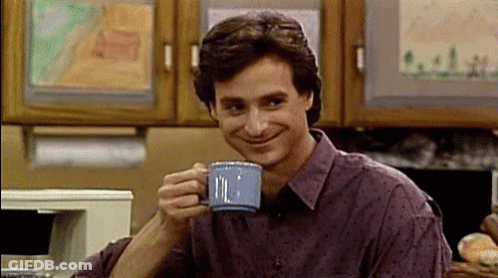 Man In Purple Shirt Drinking From Blue Mug GIF