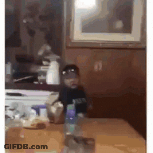 Man In Purple Shirt Hands On Hips Kitchen GIF