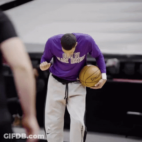 Man In Purple Shirt Holding Basketball GIF