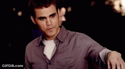Man In Purple Shirt Looking At Camera With Woman GIF