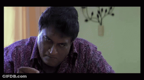Man In Purple Shirt Looking At Something GIF