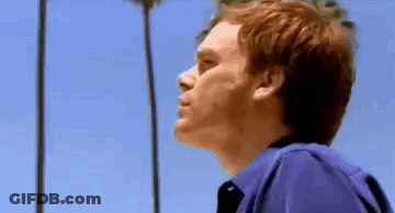 Man In Purple Shirt Looking Up At Sky GIF