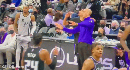 Man In Purple Shirt Next To Basketball Player GIF