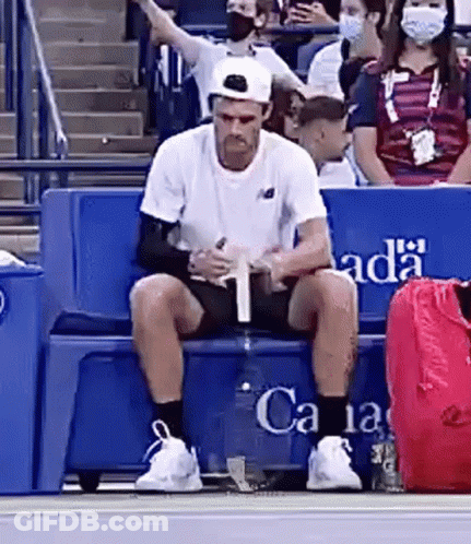 Man In Purple Shirt On Tennis Court In Front Of Emirates Sign GIF