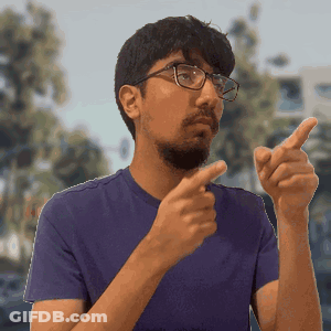 Man In Purple Shirt Pointing GIF