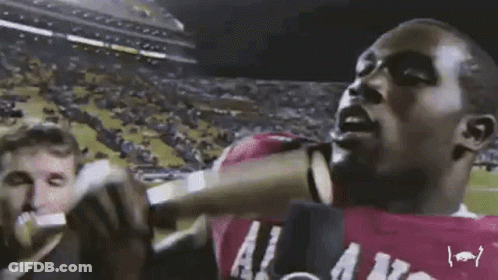 Man In Purple Shirt Saying A Little Late GIF