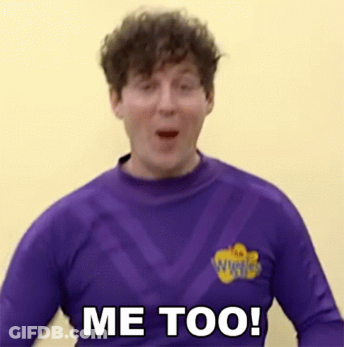 Man In Purple Shirt Saying Me Too Against Yellow Wall GIF