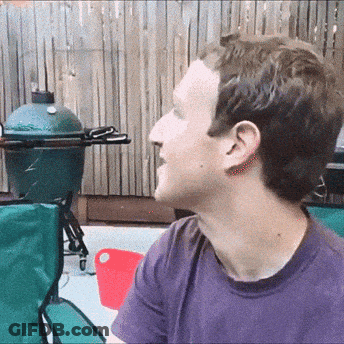 Man In Purple Shirt Sits In Front Of Green Egg Grill GIF