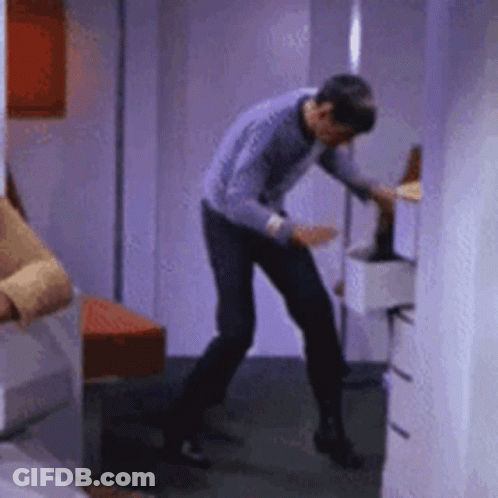 Man In Purple Shirt Standing GIF
