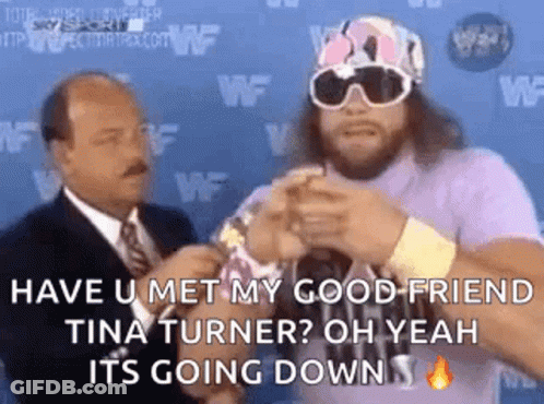 Man In Purple Shirt Talking To Suit GIF