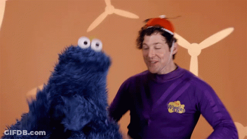 Man In Purple Shirt Wiggles GIF