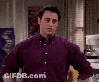 Man In Purple Shirt With Hands On Hips GIF