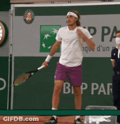 Man In Purple Shorts Holding Tennis Racquet GIF