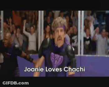 Man In Purple Standing In Front Of Crowd GIF