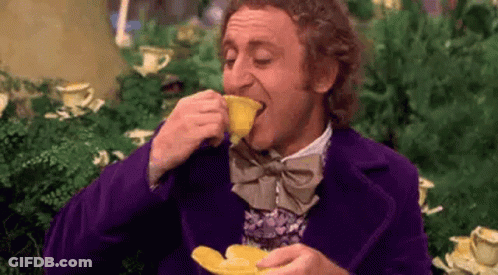 Man In Purple Suit And Bow Tie Drinking Tea GIF